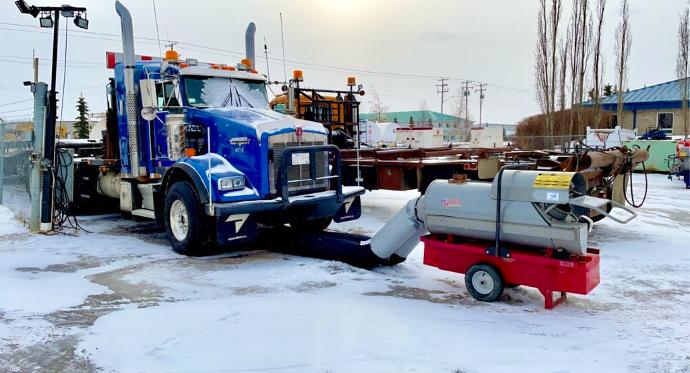 a frost fighter heating a large truck engine outside